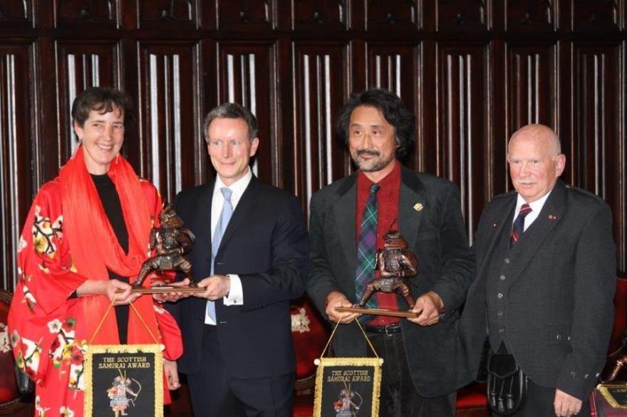 awarding Hironori and Kate